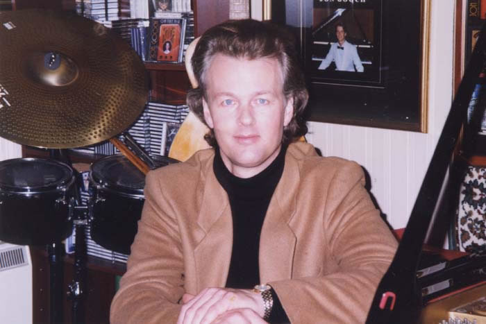 Jon England performing in sequined costume